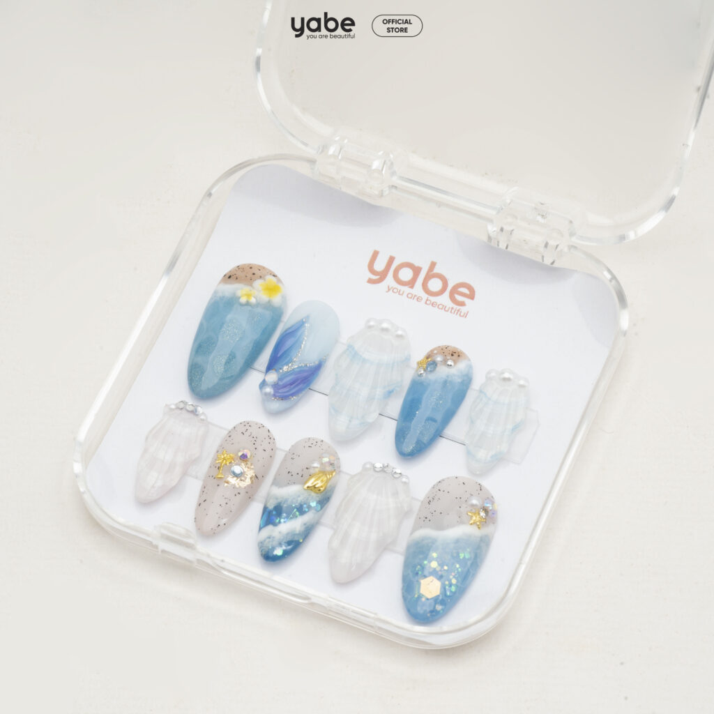 Electric blue and orange gradient nail ideas for a summer sunset look