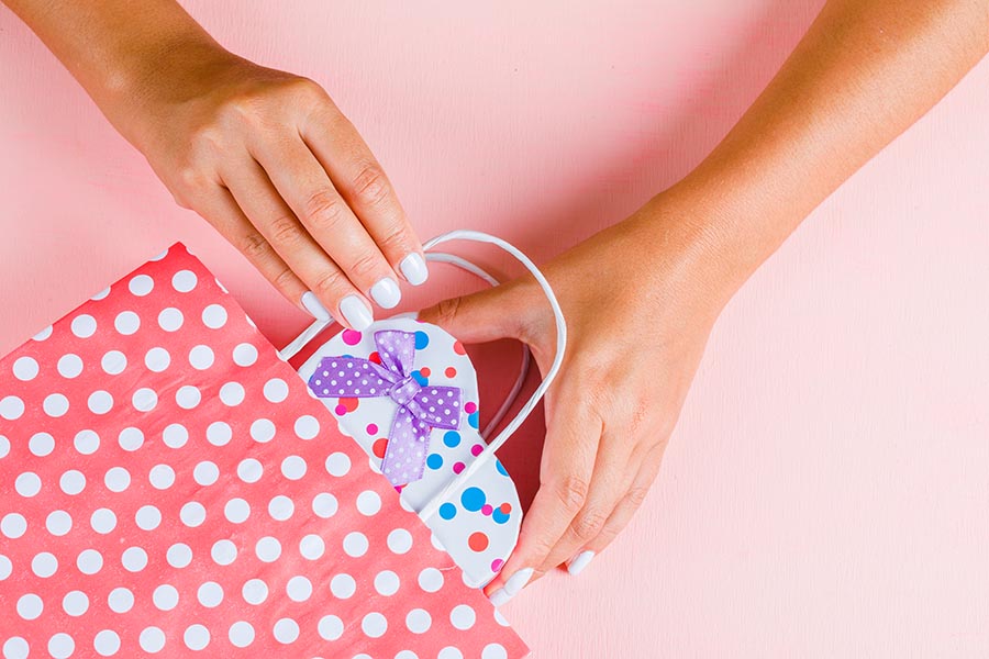A business professional preparing a package for the Press-On Nails Market