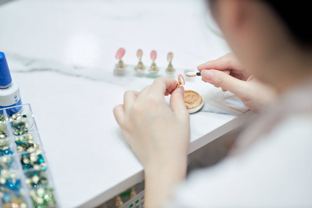 Detailed close up of a nail technician using high-quality tools for a manicure