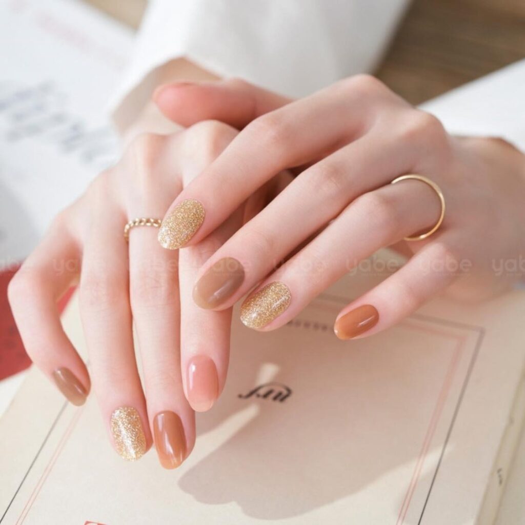 Vintage-inspired nude press-on nails with classic, elegant detailing