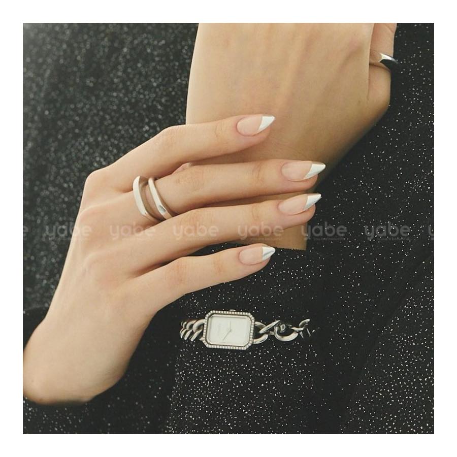 French tip press-on nails with a nude base and crisp white tips