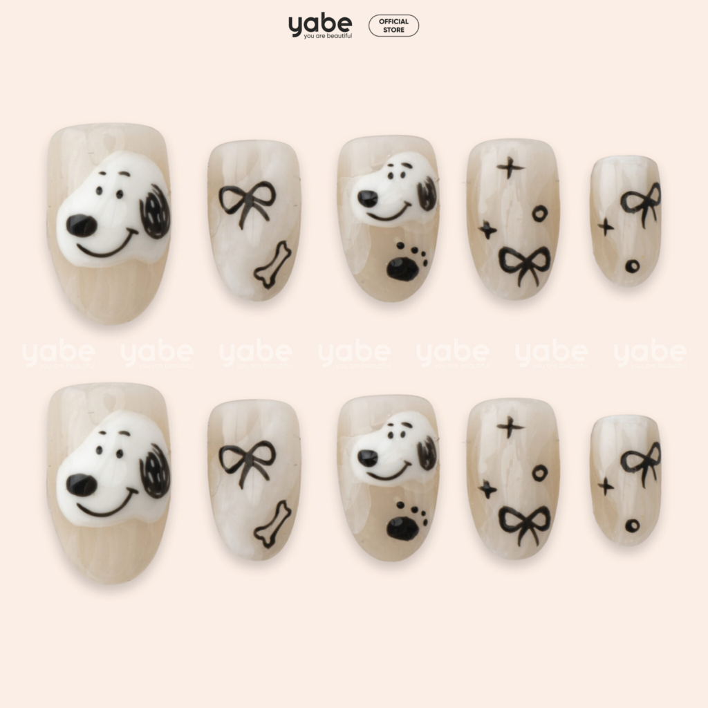 Cream mini art cute nail designs 2026 with small character detail