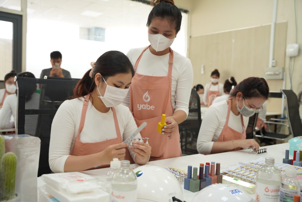 Nail technician at work