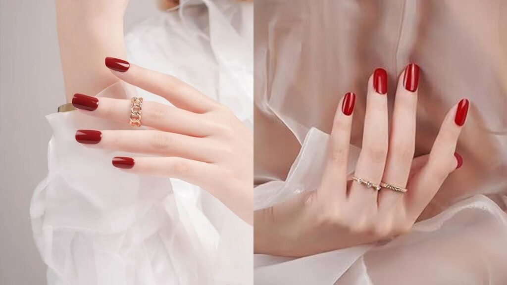 Ruby red nail polish paired with jewelry