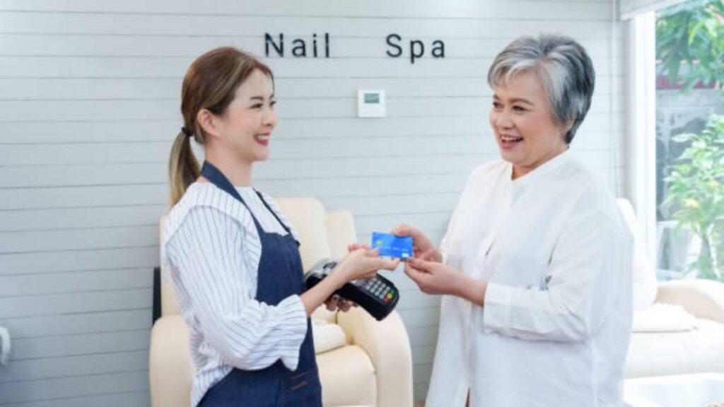 Nail technician providing customer service and recommendations