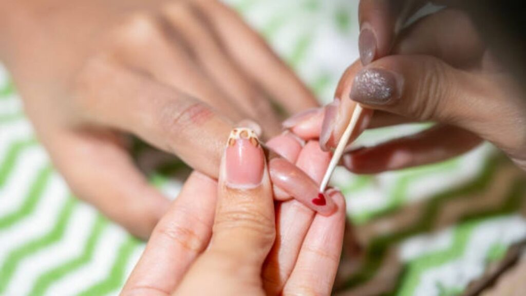 Applying acrylic or builder gel overlay in professional manicure steps