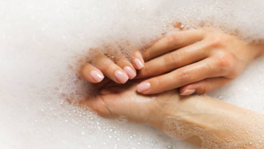 Prepping nails before applying fake nails